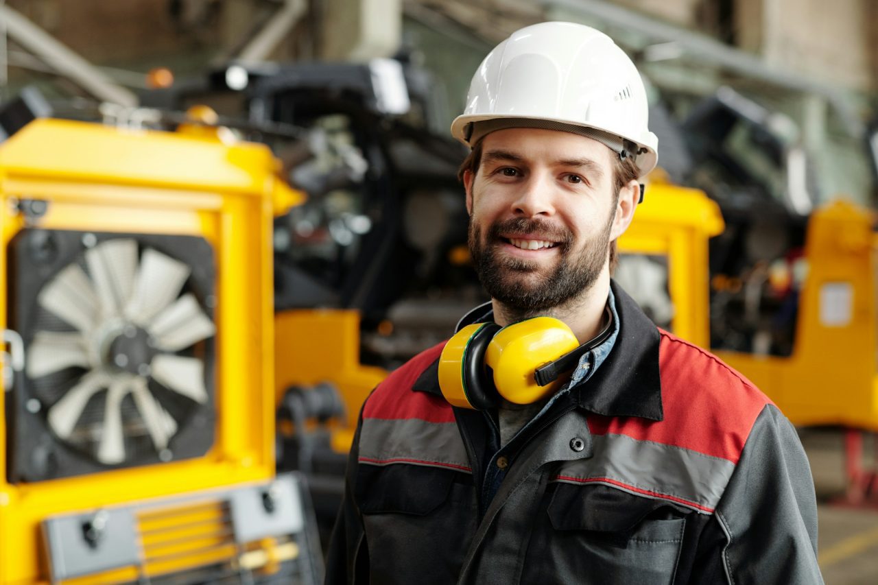 Young successful technician or repairman of industrial machines